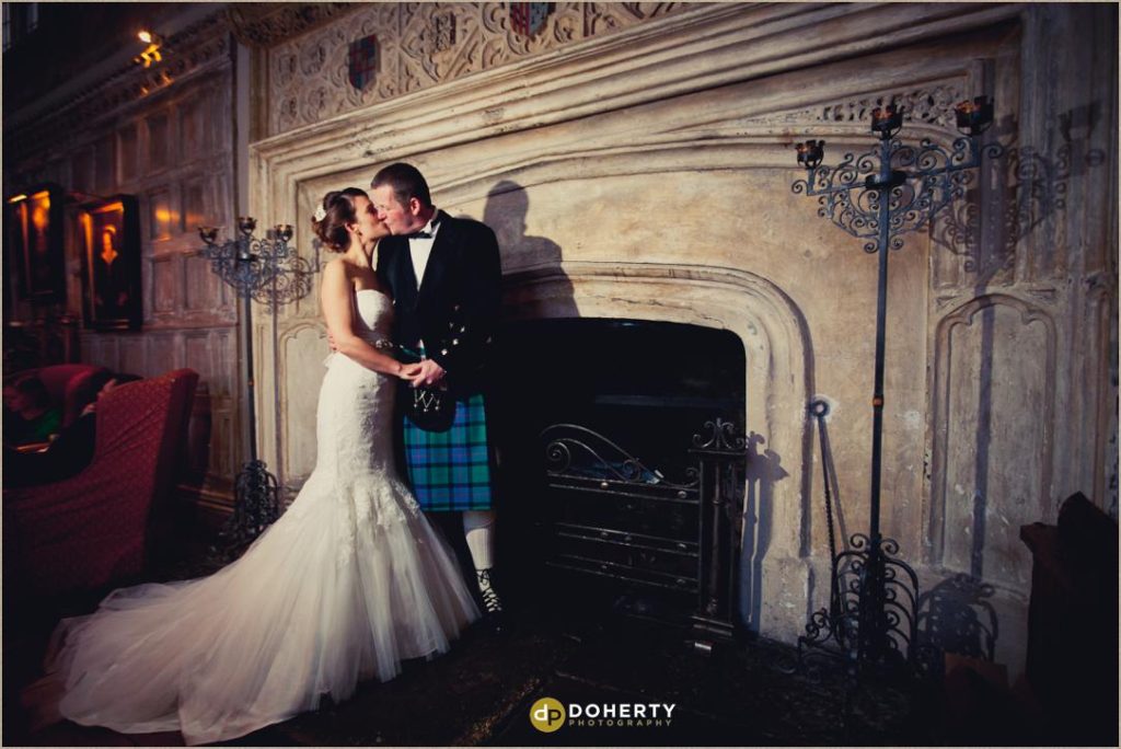 Fawsley Hall Wedding Photo at Fireplace