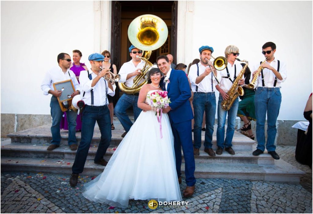 Destination Wedding photo of band playing to bride an dgroom - Portugal