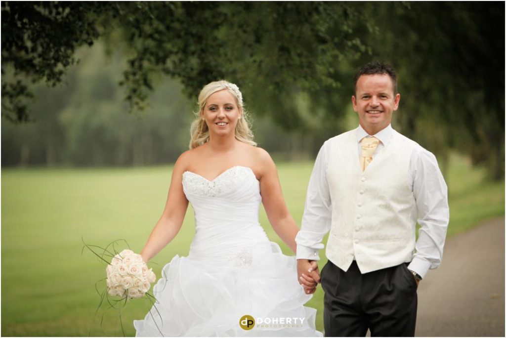 Wedding Photography of bride and groom walking - Marriott Forest of Arden