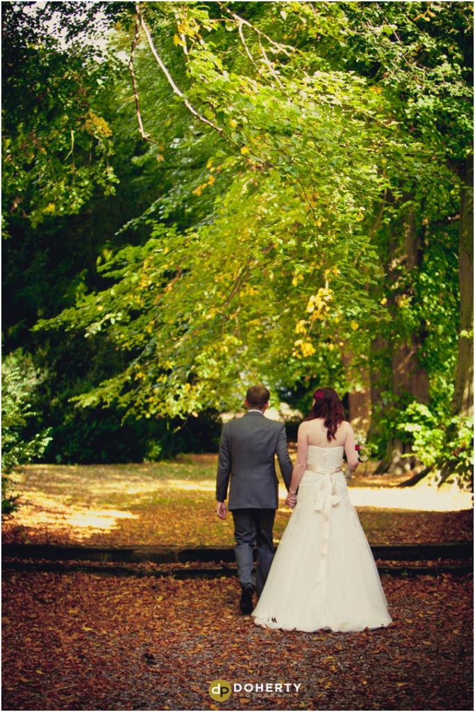 Ettington Park wedding bride and groom walking