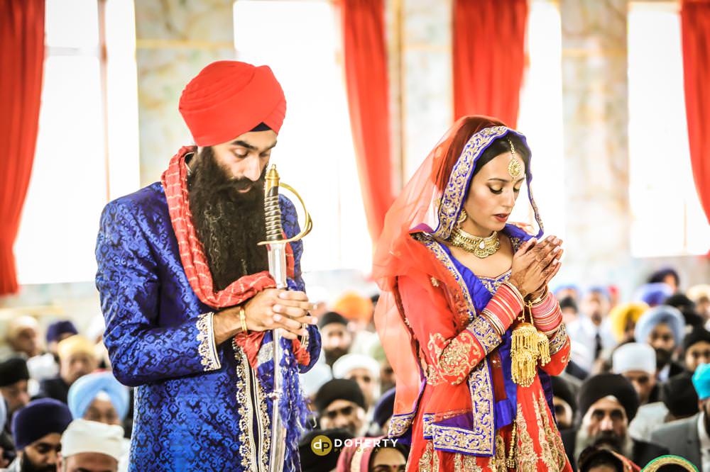 Sikh wedding photos in the temple during ceremony