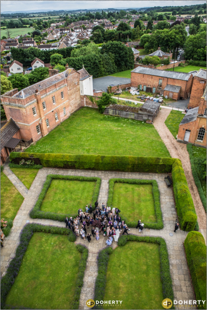 Stanbrook Abbey wedding group photo from above on tower