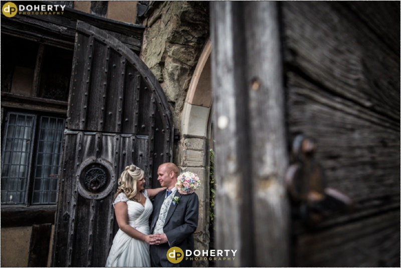 Bride and Groom at Gate at Lord Leycester