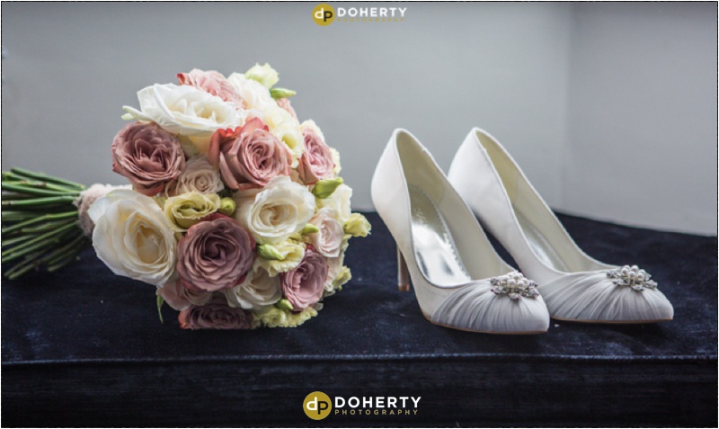 Brides shoes and flowers - Dodford Manor