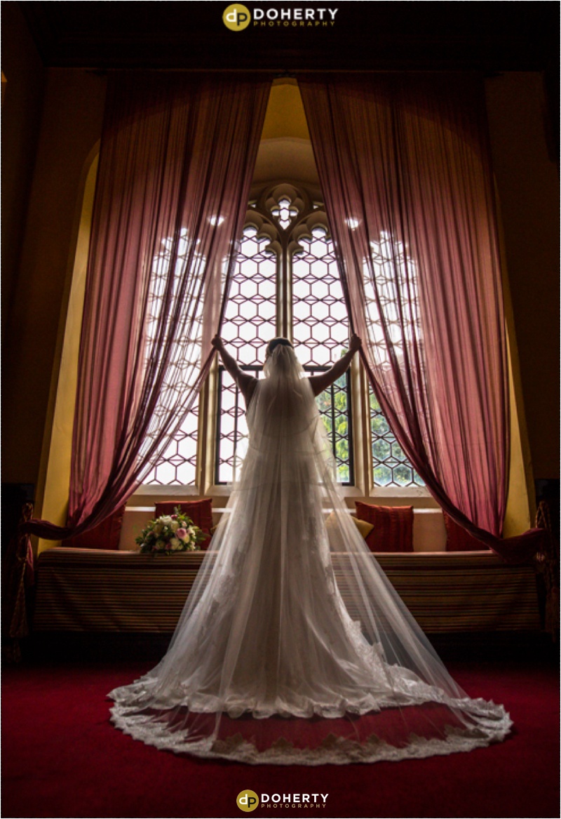Bride in De Camville room at Window