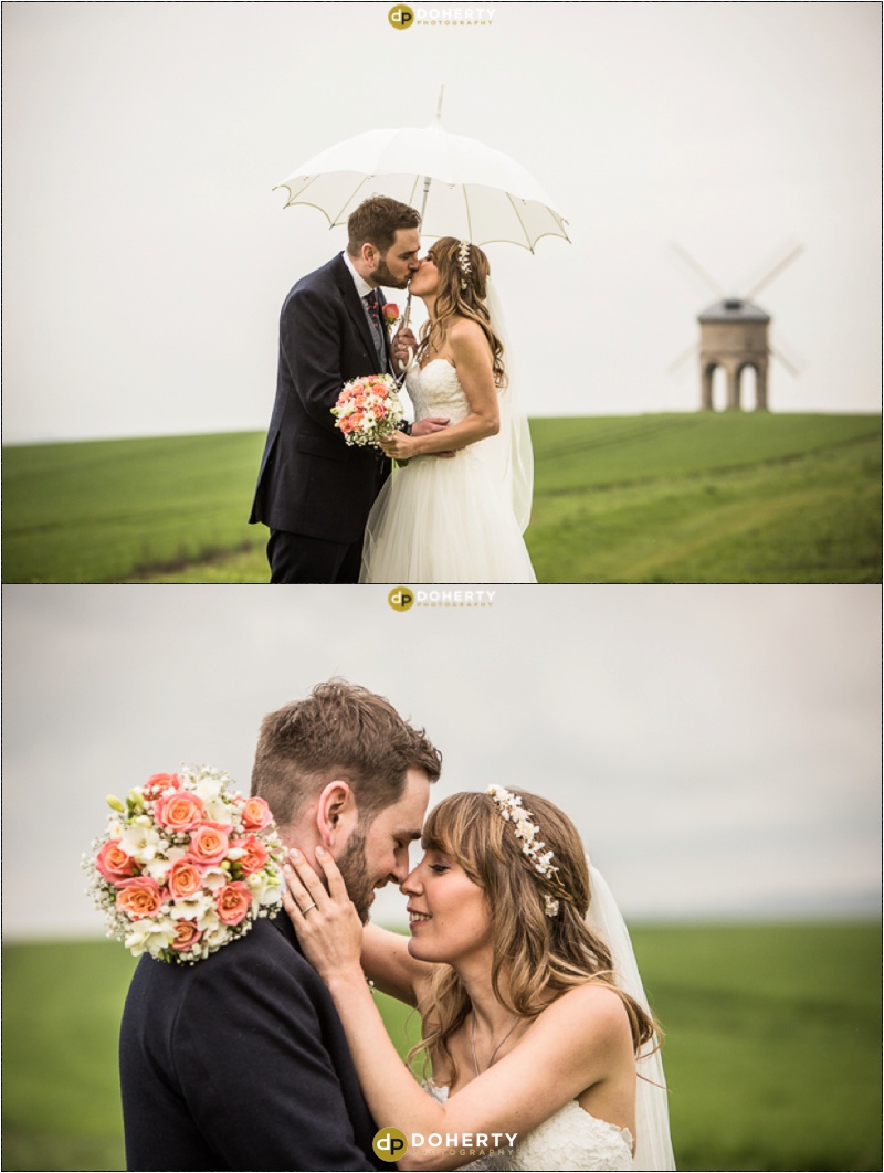 Bride andGroom at Windmill for photos in the rain