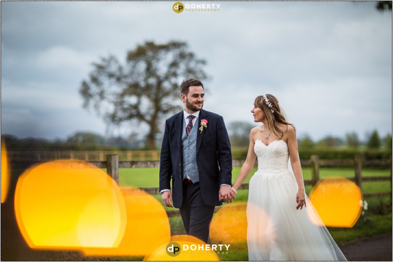 Bride and groom walking at twilight - Wedding Photography - Harbury - Warwickshire