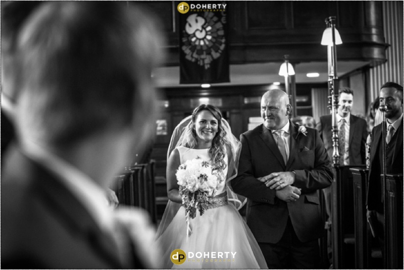 Wedding Photography - Bride walks down aisle