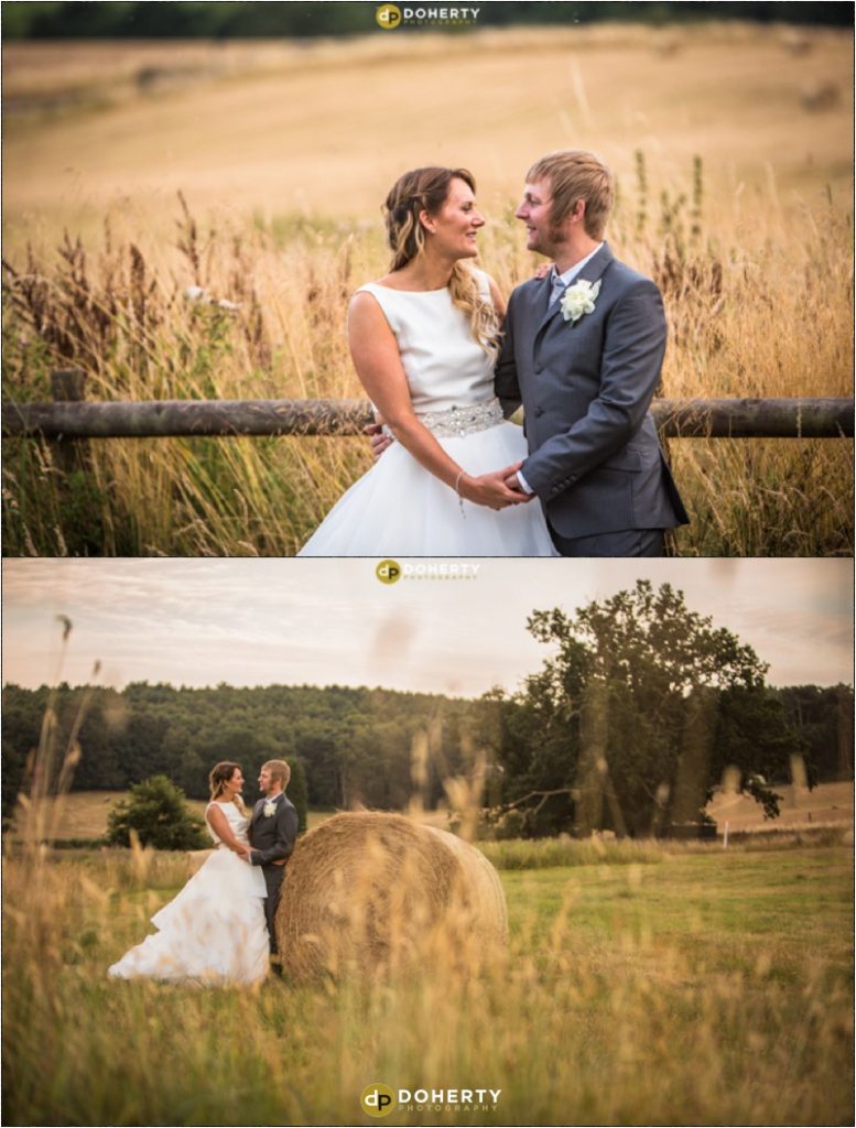Wedding Photography with the bride and groom beside hay bale - The School House