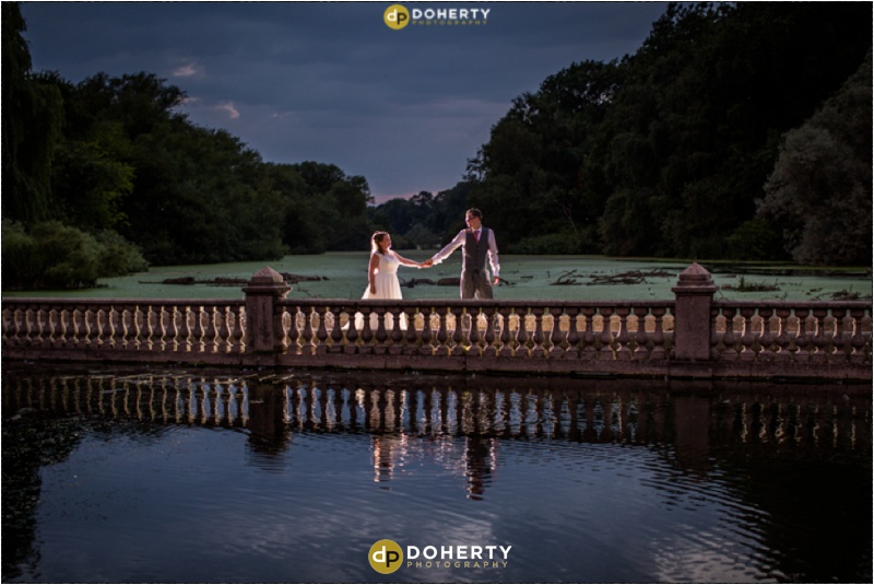 Warwickshire Wedding - Coombe Abbey Bride and Groom on Bridge at night
