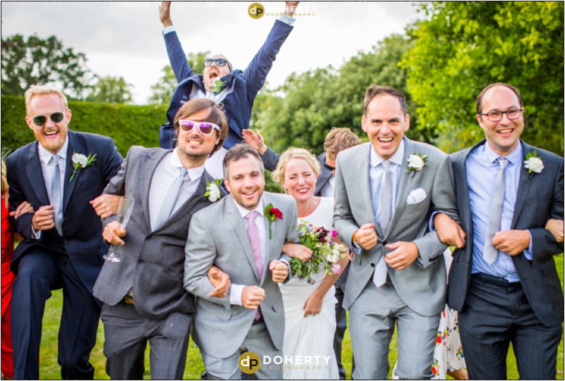 Surrey Wedding Bridal party laughing and running