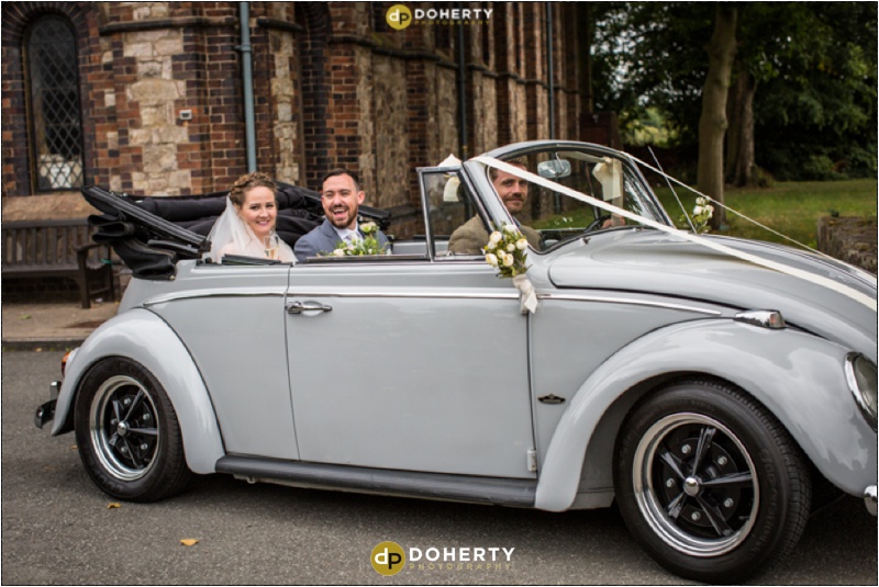 Wedding Bride and Groom in VW Beetle Car