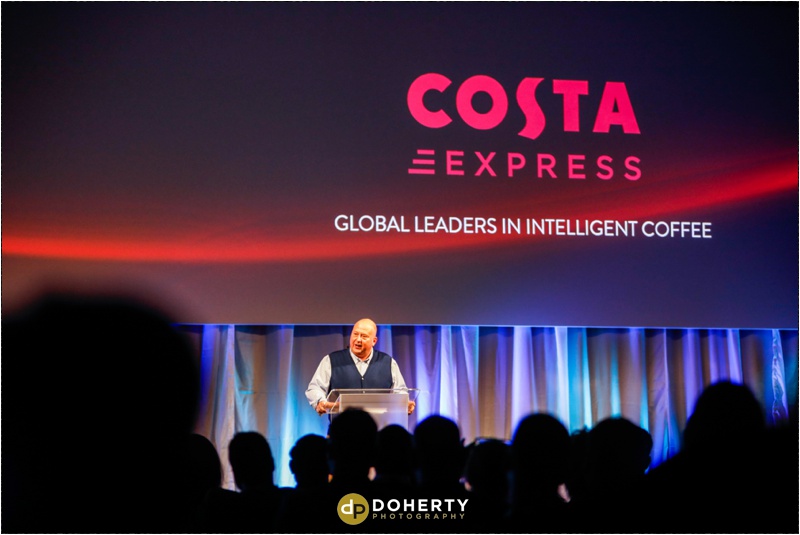 Costa Express Speaker on stage Event Photography