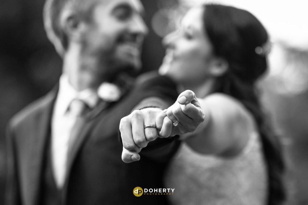 Bride and groom with focus on rings