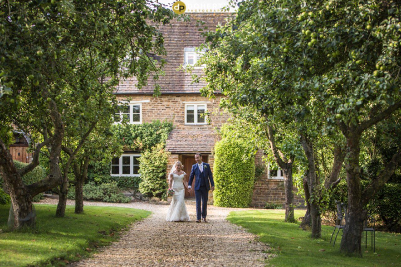 Dodmoor House Bride and Groom walking in gardens