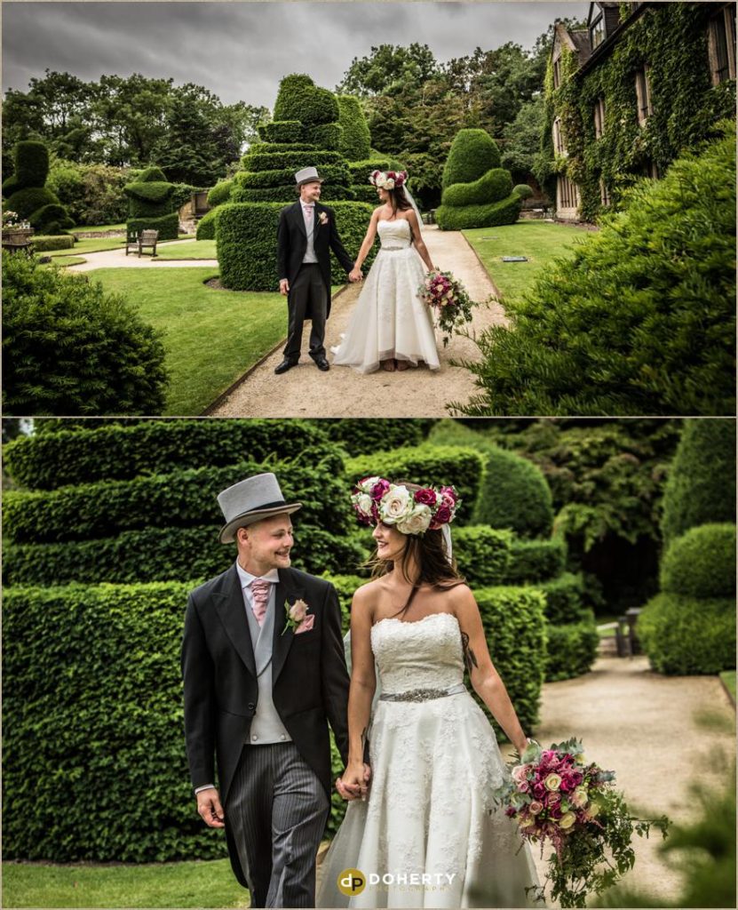 Billesley Manor - Wedding couple walking in gardens