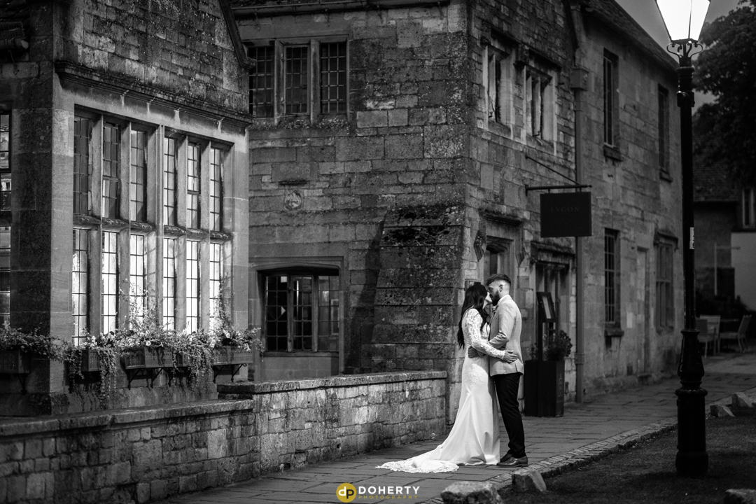 The Lygon Arms wedding venue - Bride and Groom outside at night