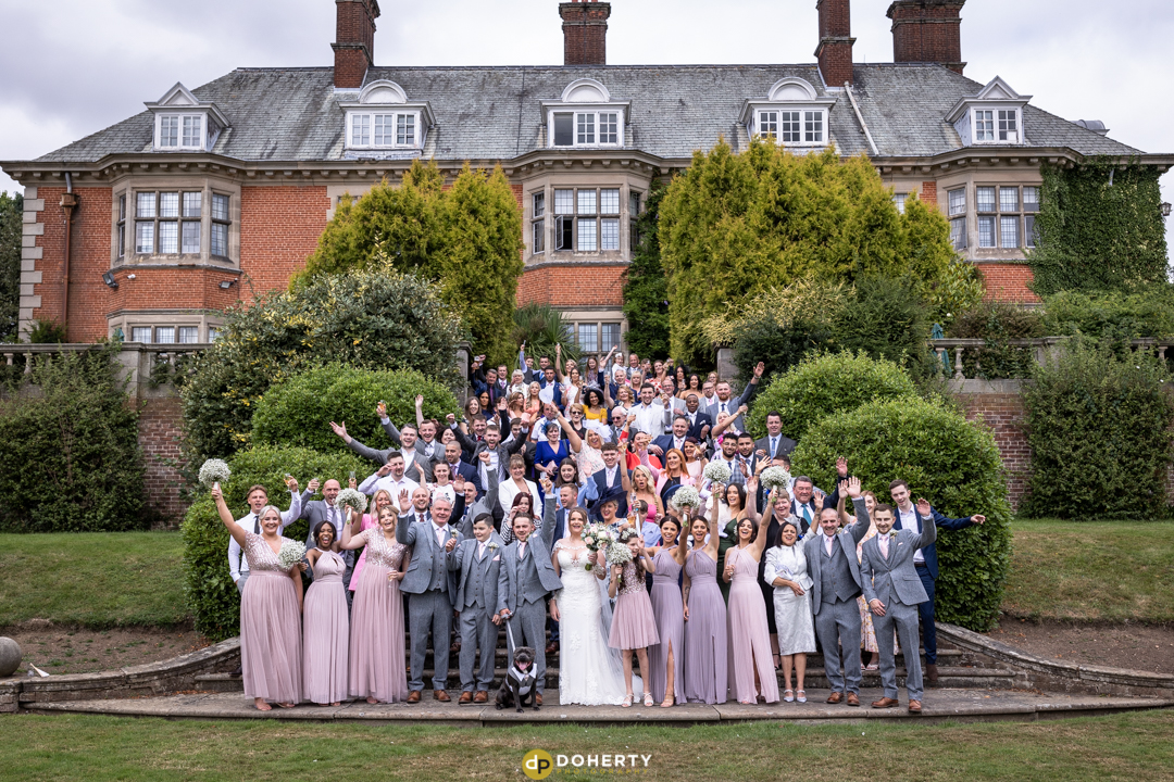 Large group photo of bridal party at Dunchurch Park wedding venue