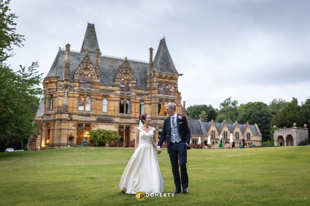 Wedding Photography with bride and groom walking - Ettington Park Hotel