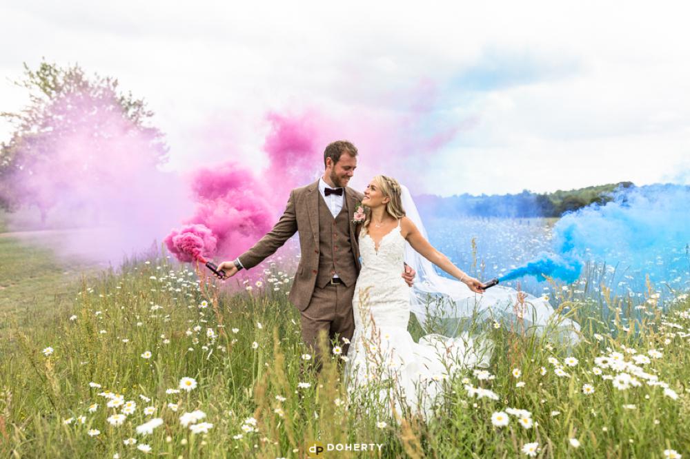 WEdding bride and groom with smoke bombs at Crockwell Farm