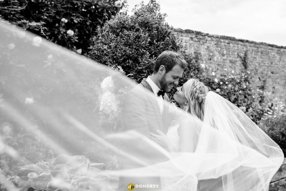 Veil photo with bride and groom at Crockwell