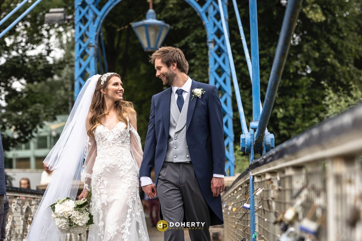 Bride and groom on bridge at Jephson Gardens in Leamington Spa