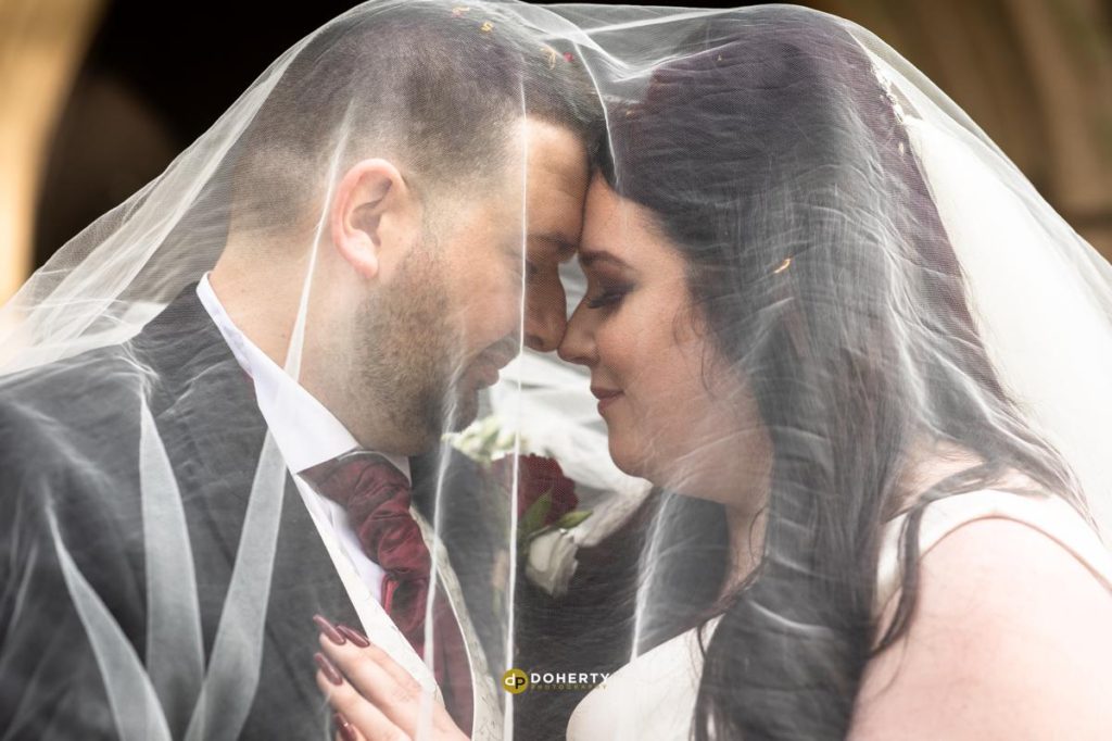 Wedding Photography - Prestwold Hall - bride and groom under veil