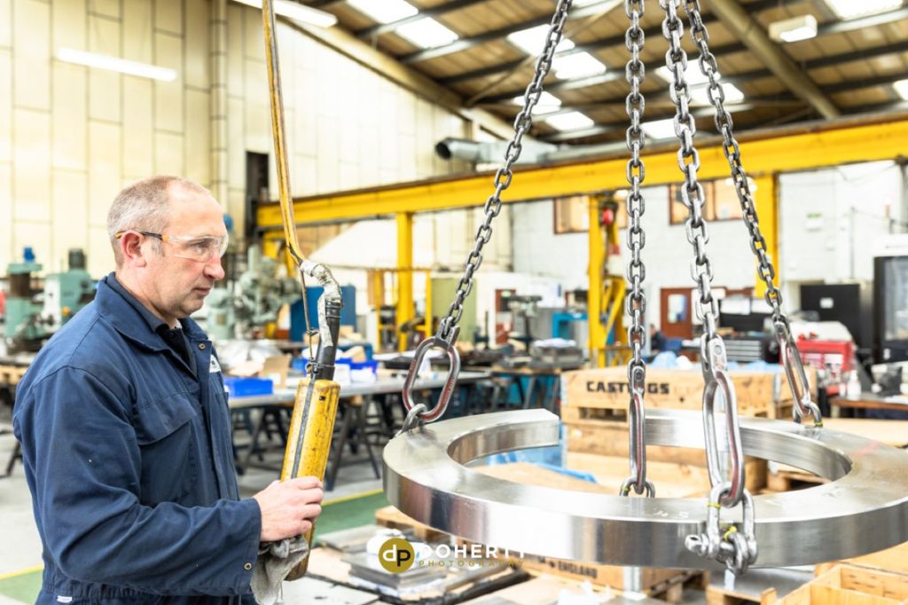 Accura - man operating machine at sheet metal fabrication unit in Wolverhampton