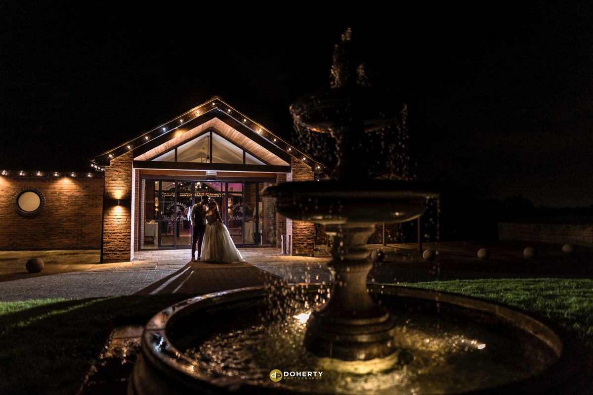 Aston Marina at night with bride and groom