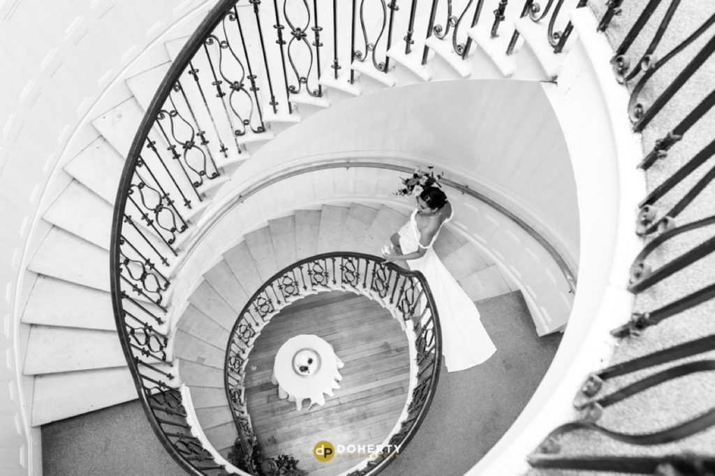 staircase at Eastington park with bride