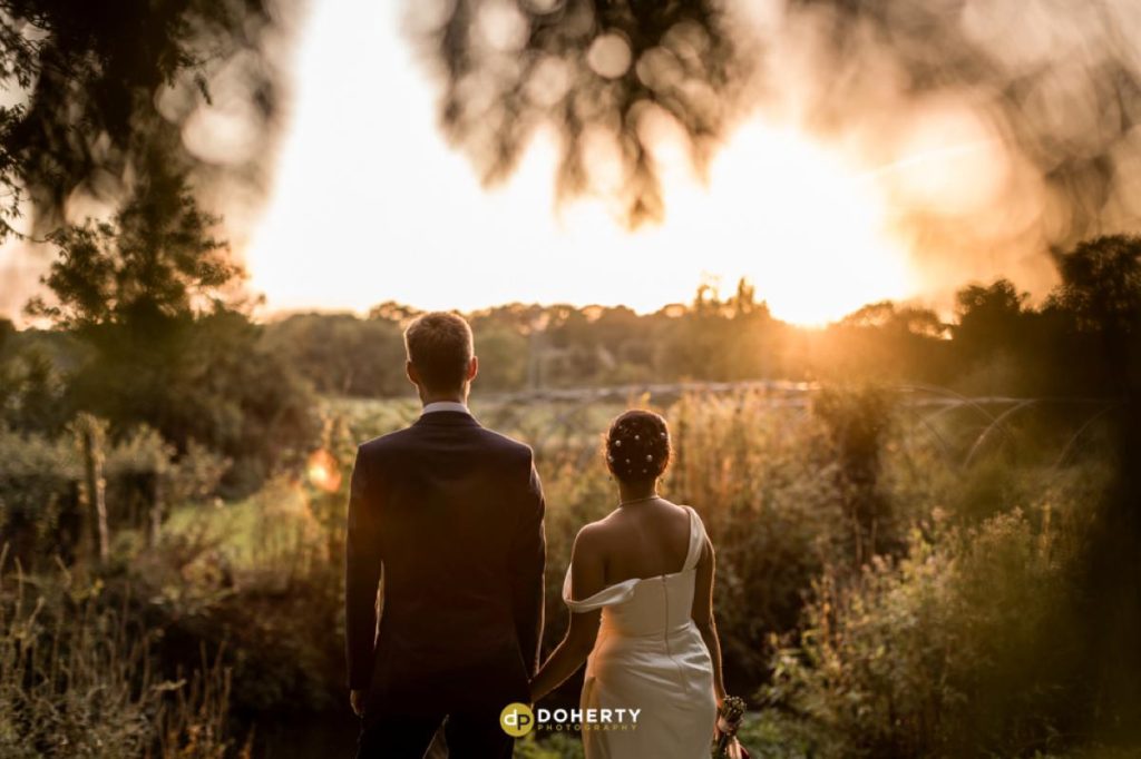Sunset photo at Eastington park with Bride and groom